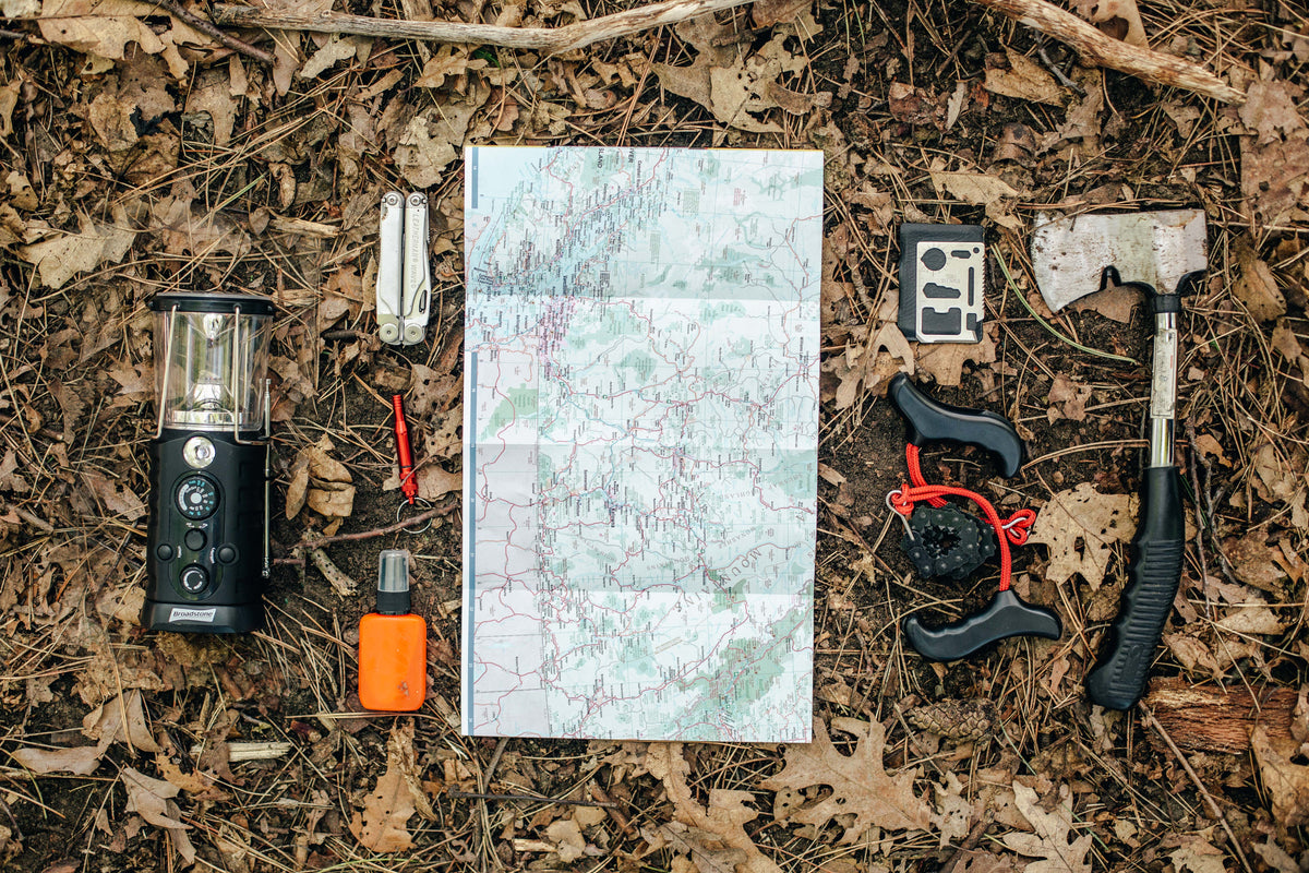 Camping gear laid out on the ground