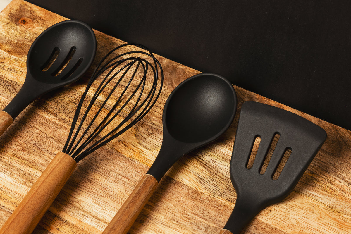 Kitchen utensils on a wooden counter