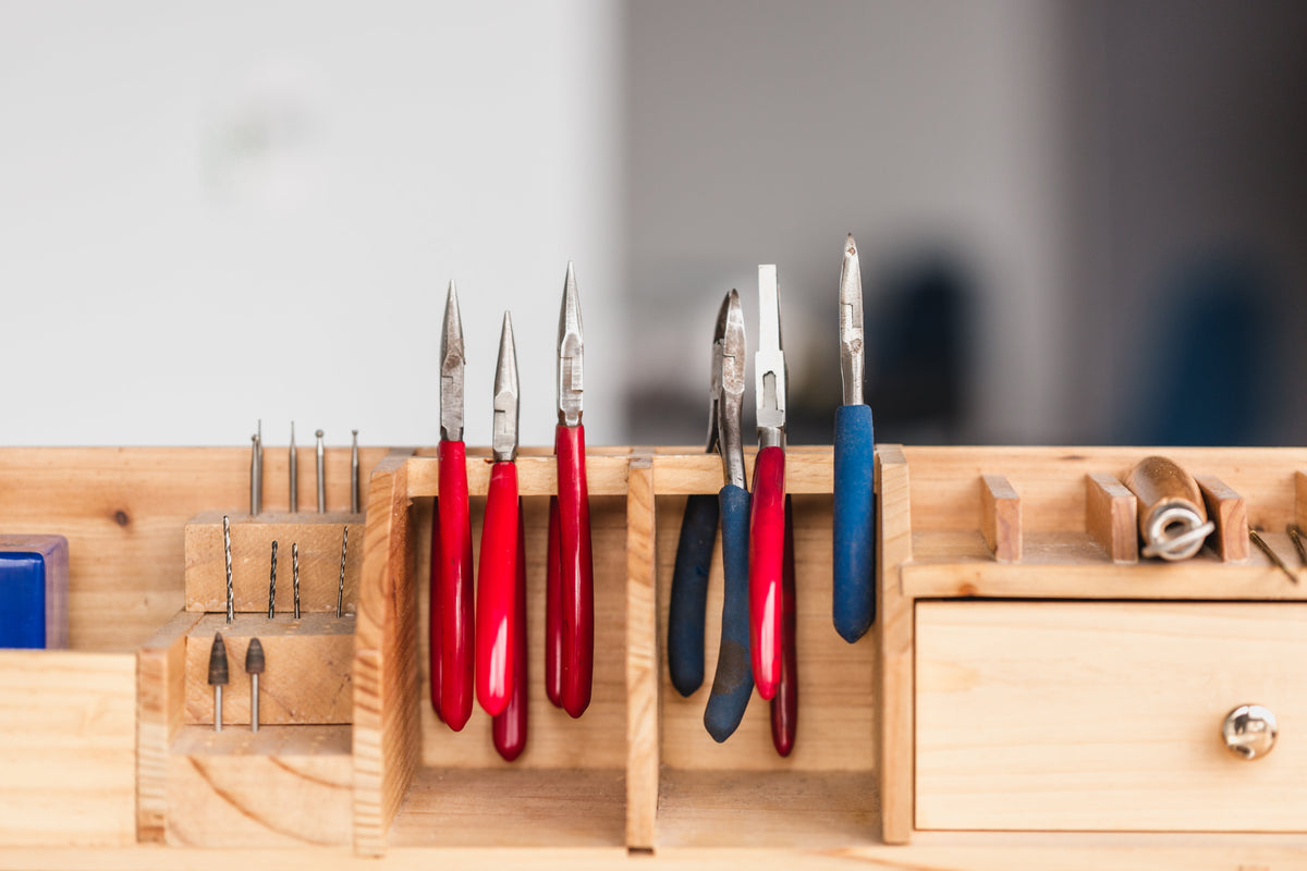 Hand tools lined up on a workbench